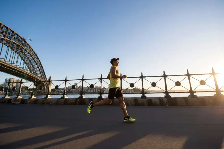 Flat marathon road with athletes running toward the horizon