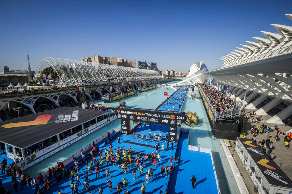 Valencia Marathon finish zone with cheering spectators and runners